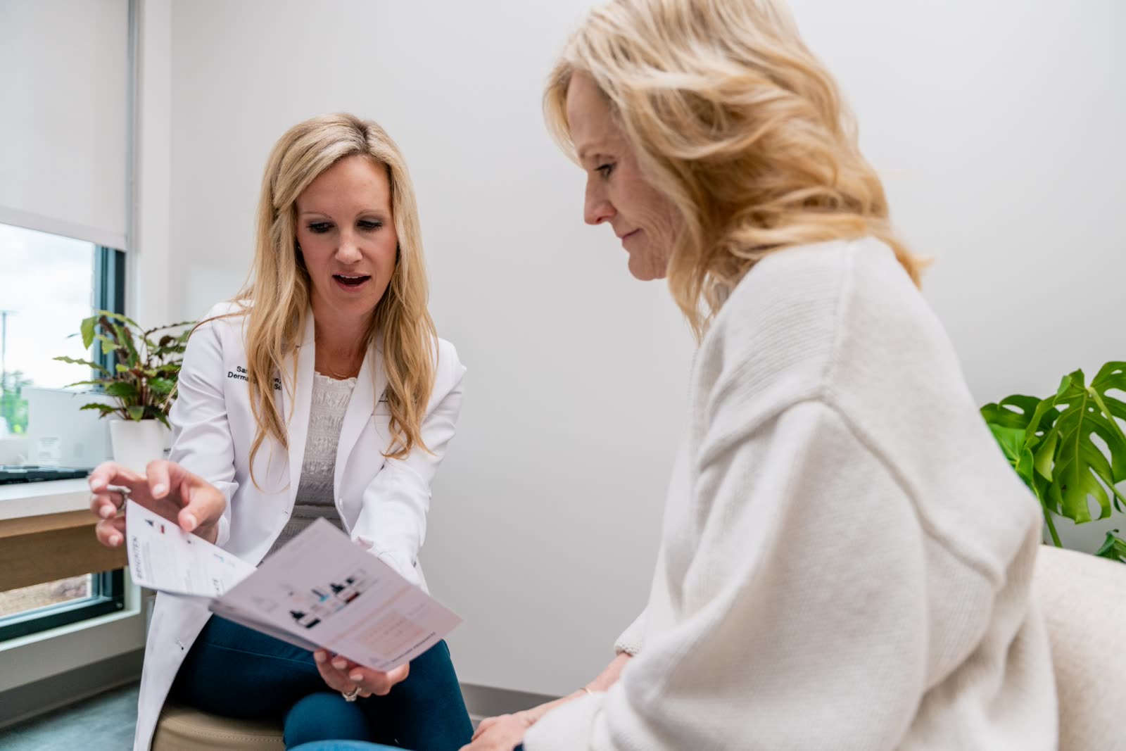 A consulter and guest going through a treatment plan together