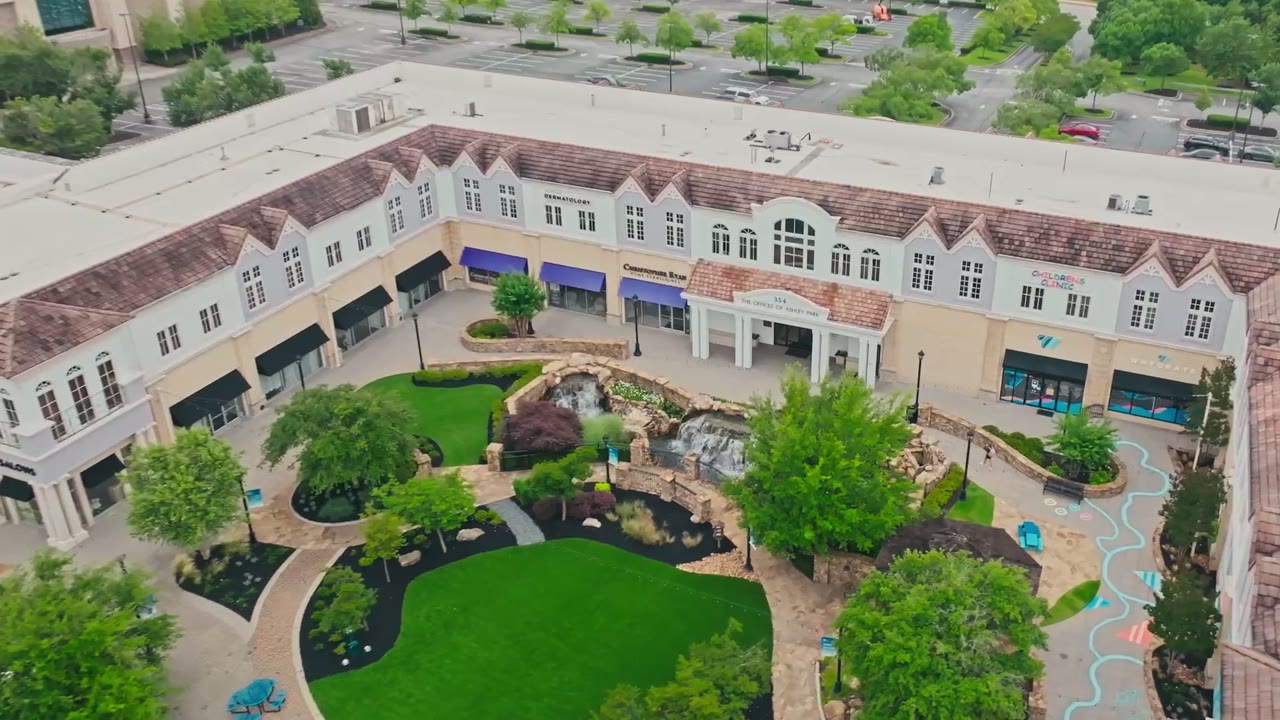 Aerial view of Ashley Park in Newnan, GA, the shopping center that is home to the Carroll Cosmetic Club Newnan studio