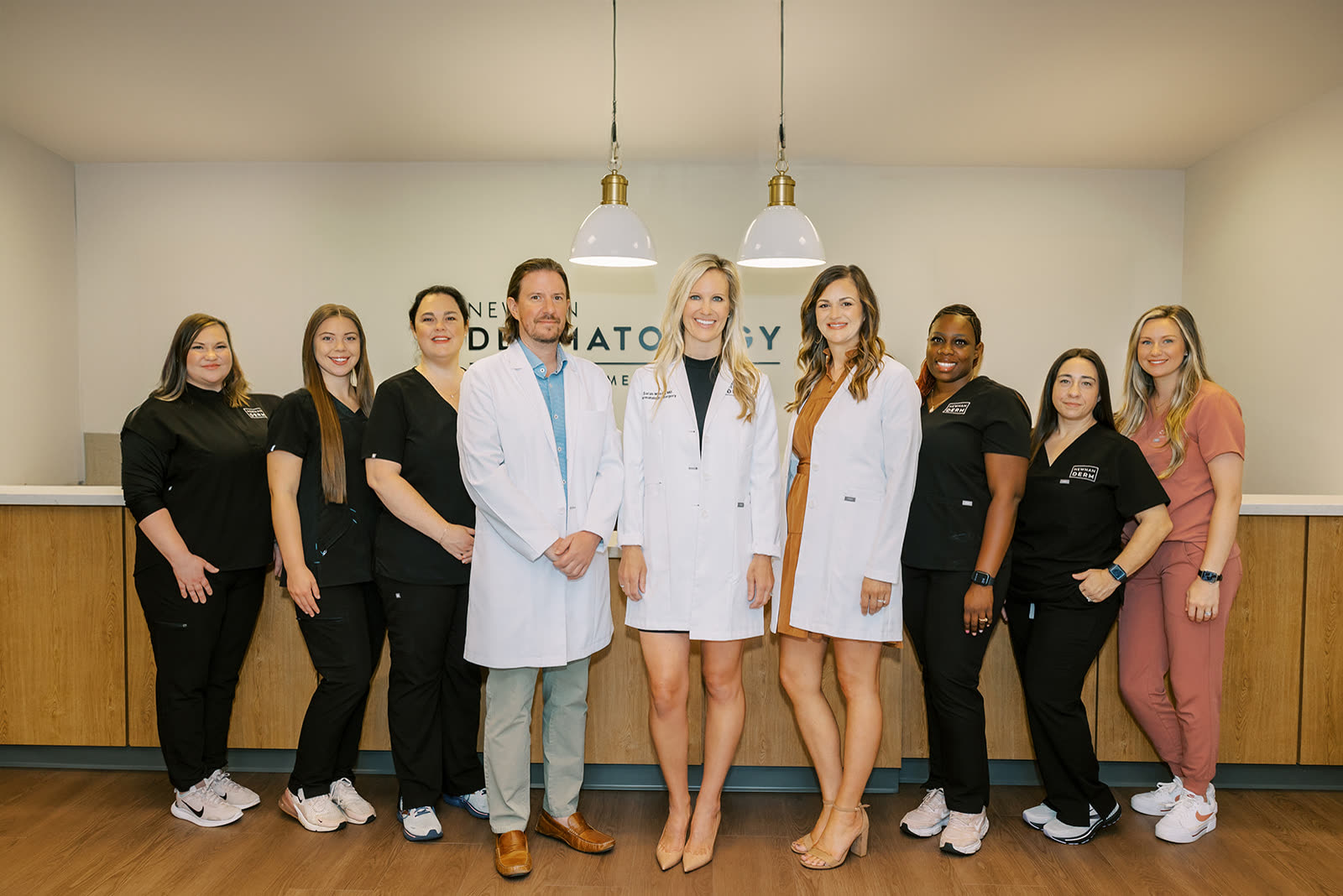 The Newnan Dermatology front-desk team who check in Carroll Cosmetic Club Newnan guests