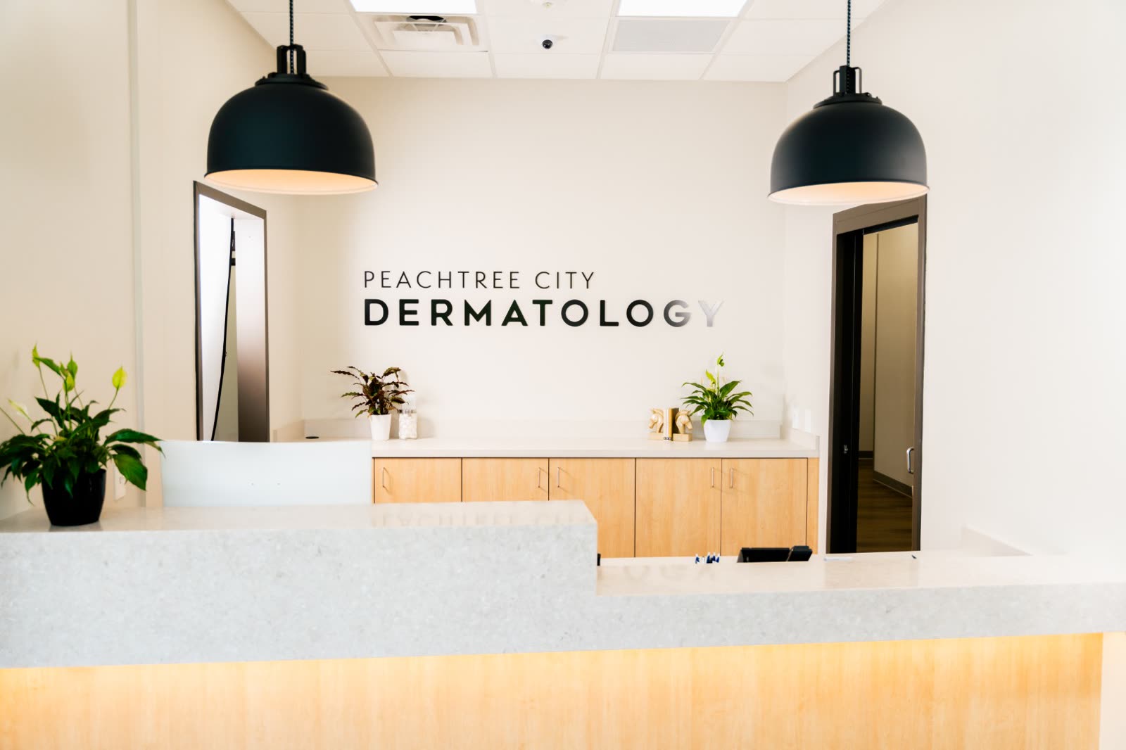 The welcome desk at Peachtree City Dermatology where Carroll Cosmetic Club Peachtree City guests check in