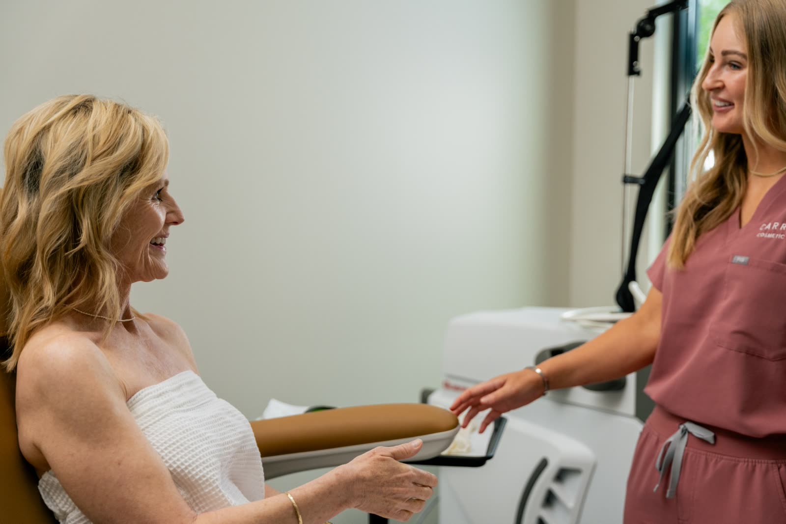 Certified laser specialist welcoming a guest for laser hair removal